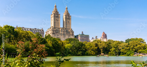 Skyline panorama with Eldorado building and reservoir with boats in Central Park in midtown Manhattan in New York City