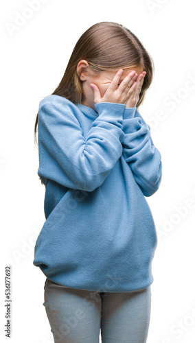 Young beautiful girl wearing winter sweater over isolated background with sad expression covering face with hands while crying. Depression concept.