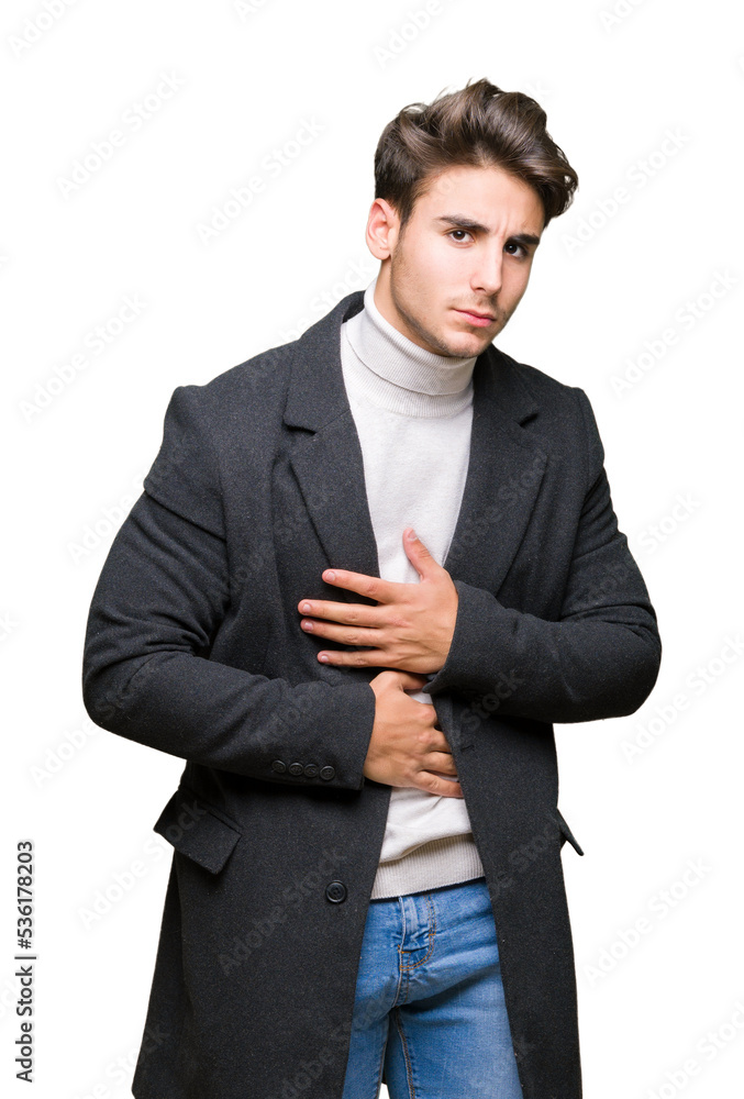 Young elegant man wearing winter coat over isolated background with hand on stomach because indigestion, painful illness feeling unwell. Ache concept. Young elegant man wearing winter coat over isolated background with hand on stomach because indigestion, painful illness feeling unwell. Ache concept.