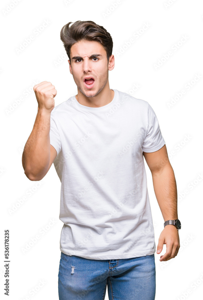 Young handsome man wearing white t-shirt over isolated background angry and mad raising fist frustrated and furious while shouting with anger. Rage and aggressive concept. Young handsome man wearing white t-shirt over isolated background angry and mad raising fist frustrated and furious while shouting with anger. Rage and aggressive concept.
