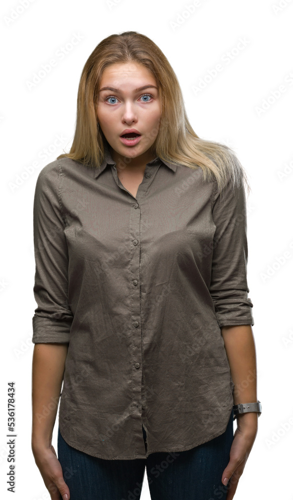 Young caucasian business woman over isolated background afraid and shocked with surprise expression, fear and excited face. Young caucasian business woman over isolated background afraid and shocked with surprise expression, fear and excited face.