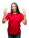 Young beautiful caucasian woman over isolated background showing and pointing up with fingers number ten while smiling confident and happy.