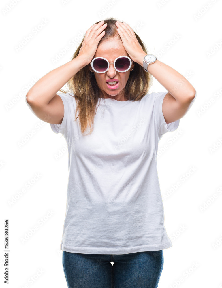 Middle age hispanic woman wearing fashion sunglasses over isolated background suffering from headache desperate and stressed because pain and migraine. Hands on head. Middle age hispanic woman wearing fashion sunglasses over isolated background suffering from headache desperate and stressed because pain and migraine. Hands on head.