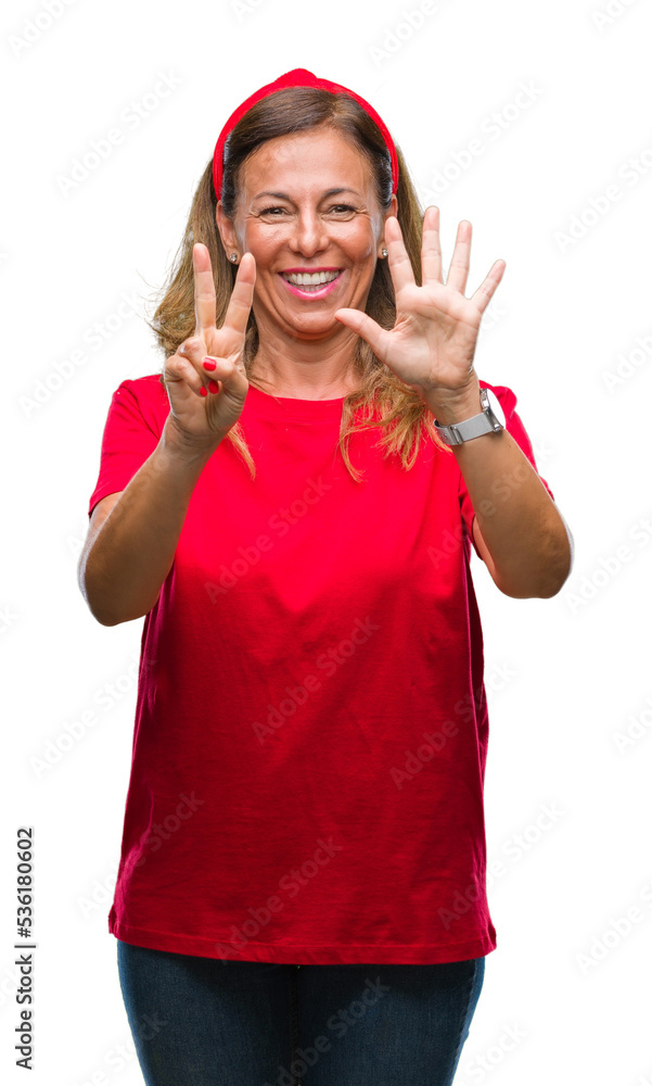 Middle age senior hispanic woman over isolated background showing and pointing up with fingers number seven while smiling confident and happy. Middle age senior hispanic woman over isolated background showing and pointing up with fingers number seven while smiling confident and happy.
