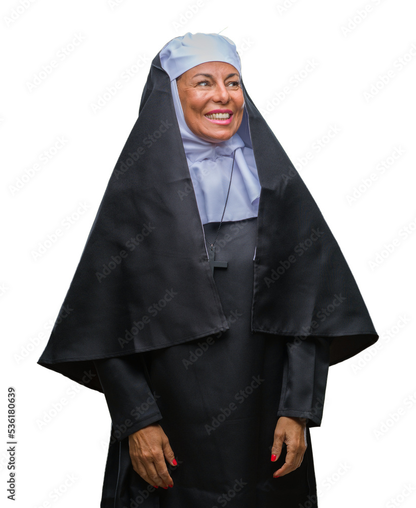 Middle age senior christian catholic nun woman over isolated background looking away to side with smile on face, natural expression. Laughing confident. Middle age senior christian catholic nun woman over isolated background looking away to side with smile on face, natural expression. Laughing confident.