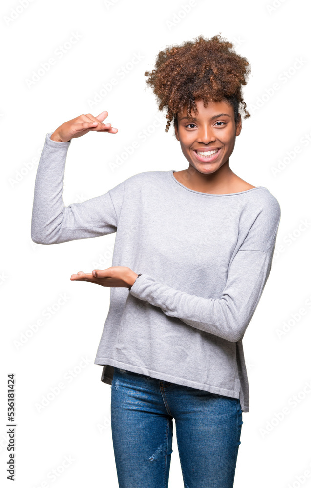Beautiful young african american woman over isolated background gesturing with hands showing big and large size sign, measure symbol. Smiling looking at the camera. Measuring concept. Beautiful young african american woman over isolated background gesturing with hands showing big and large size sign, measure symbol. Smiling looking at the camera. Measuring concept.