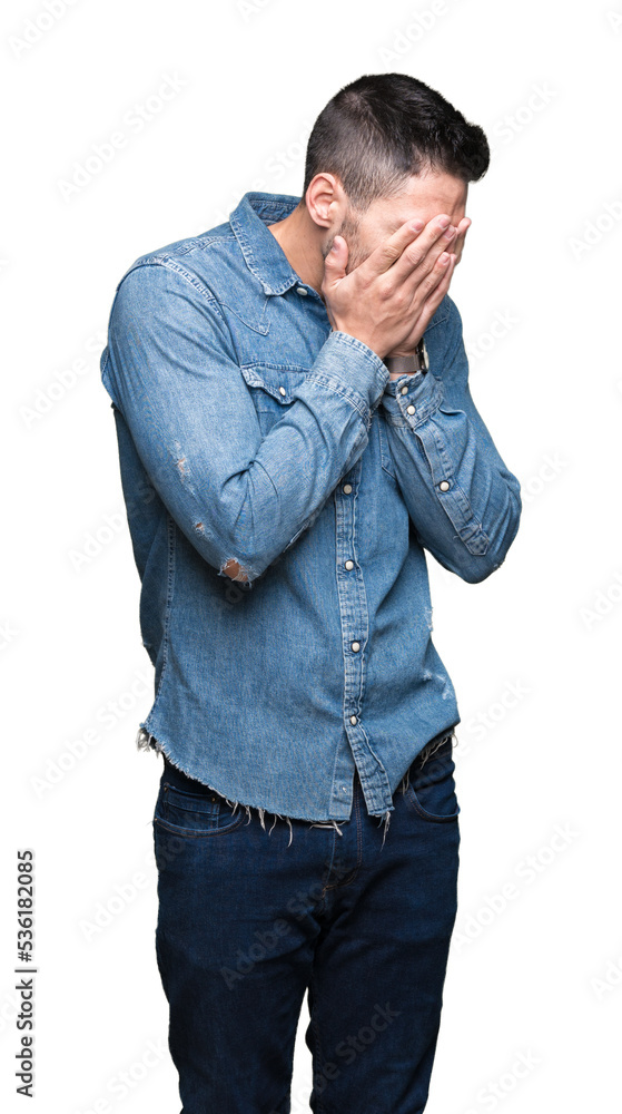 Young handsome man over isolated background with sad expression covering face with hands while crying. Depression concept. Young handsome man over isolated background with sad expression covering face with hands while crying. Depression concept.