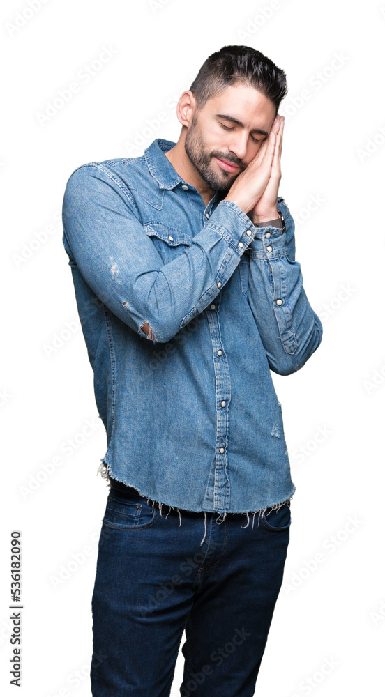 Young handsome man over isolated background sleeping tired dreaming and posing with hands together while smiling with closed eyes. Young handsome man over isolated background sleeping tired dreaming and posing with hands together while smiling with closed eyes.