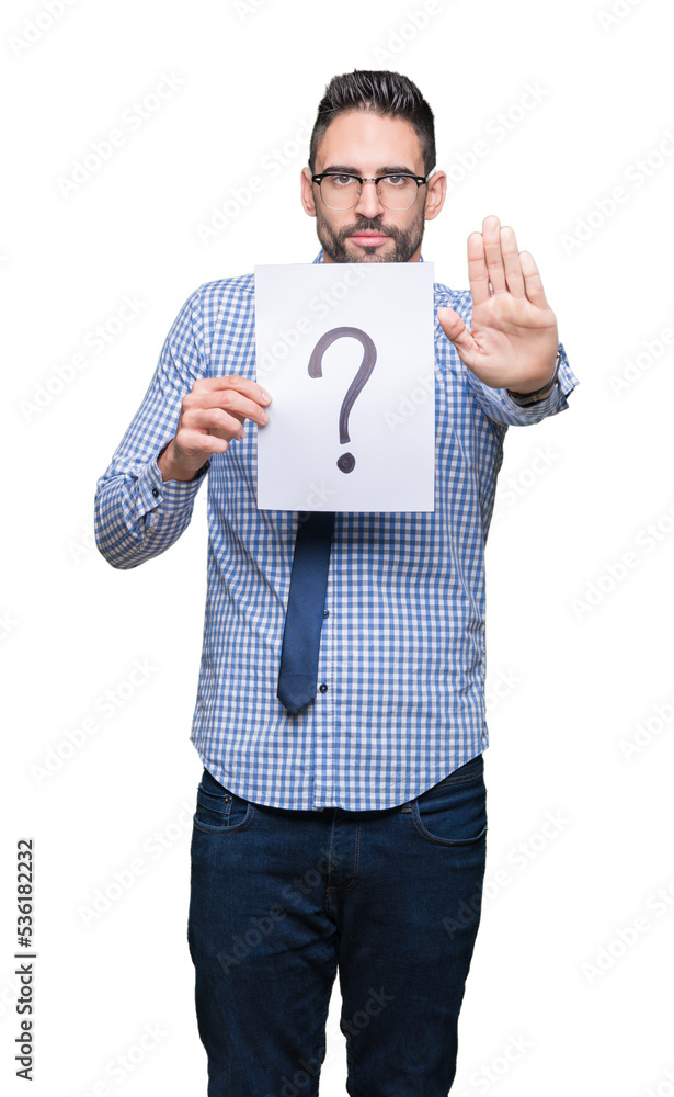 Handsome young business man holding paper with question mark over isolated background with open hand doing stop sign with serious and confident expression, defense gesture Handsome young business man holding paper with question mark over isolated background with open hand doing stop sign with serious and confident expression, defense gesture