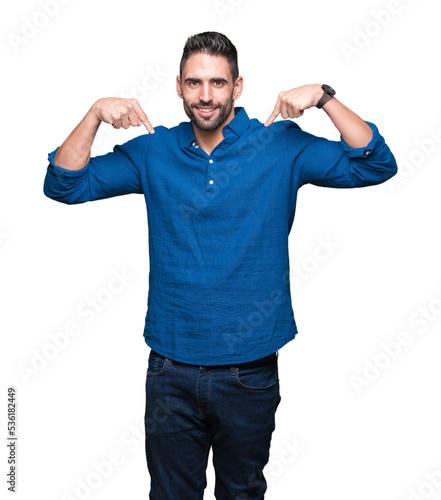 Young handsome man over isolated background looking confident with smile on face, pointing oneself with fingers proud and happy.