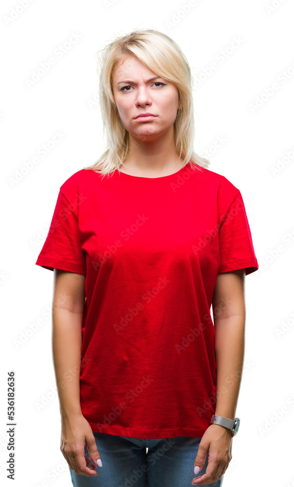 Young beautiful blonde woman wearing red t-shirt over isolated background skeptic and nervous, frowning upset because of problem. Negative person. Young beautiful blonde woman wearing red t-shirt over isolated background skeptic and nervous, frowning upset because of problem. Negative person.