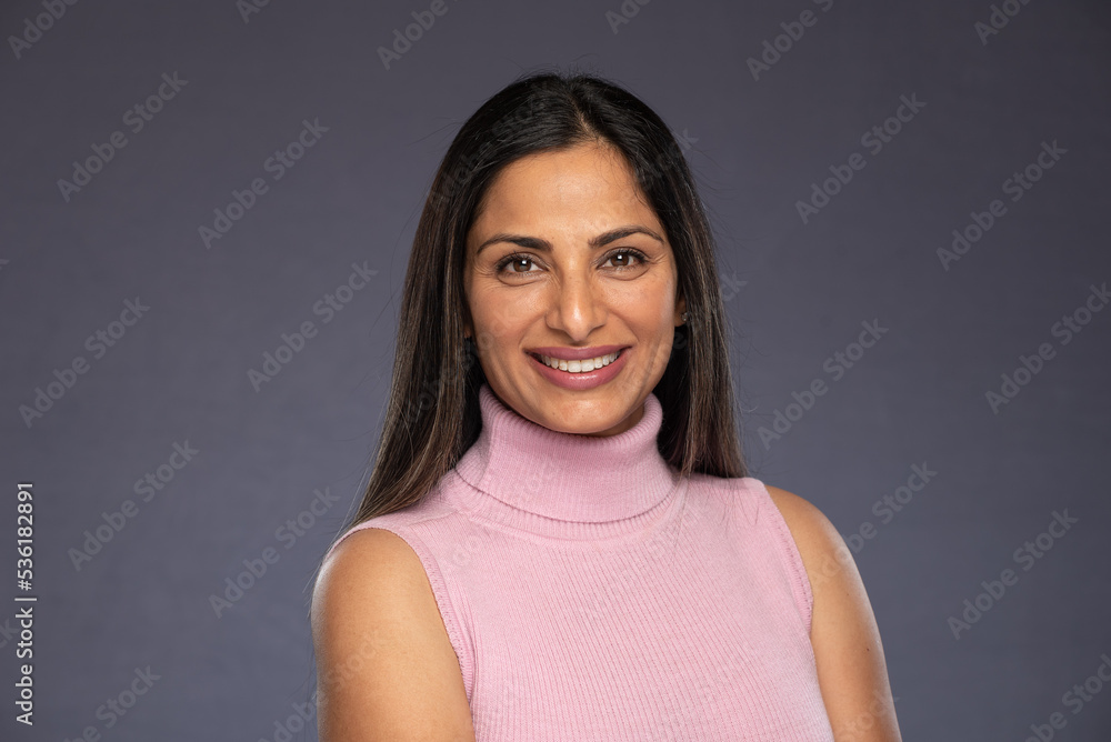 Studio headshots of beautiful Asian Indian woman in business attire on gray background. Studio headshots of beautiful Asian Indian woman in business attire on gray background.