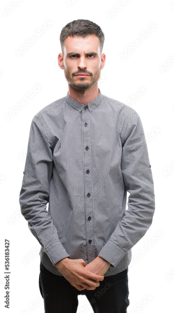 Young hipster man skeptic and nervous, frowning upset because of problem. Negative person. Young hipster man skeptic and nervous, frowning upset because of problem. Negative person.