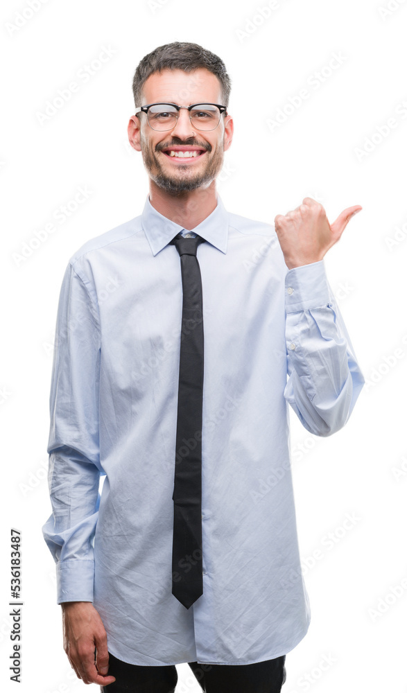 Young business man pointing and showing with thumb up to the side with happy face smiling Young business man pointing and showing with thumb up to the side with happy face smiling