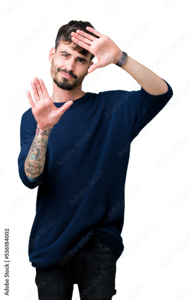 Fototapeta premium Young handsome man over isolated background Smiling doing frame using hands palms and fingers, camera perspective