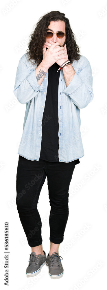 Young hipster man with long hair and beard wearing sunglasses shocked covering mouth with hands for mistake. Secret concept. Young hipster man with long hair and beard wearing sunglasses shocked covering mouth with hands for mistake. Secret concept.