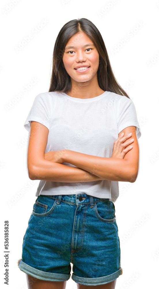 Obraz premium Young asian woman over isolated background happy face smiling with crossed arms looking at the camera. Positive person.