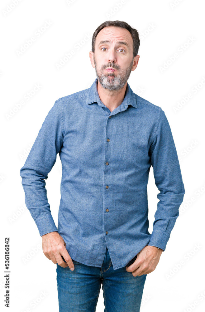 Handsome middle age elegant senior man over isolated background puffing cheeks with funny face. Mouth inflated with air, crazy expression. Handsome middle age elegant senior man over isolated background puffing cheeks with funny face. Mouth inflated with air, crazy expression.