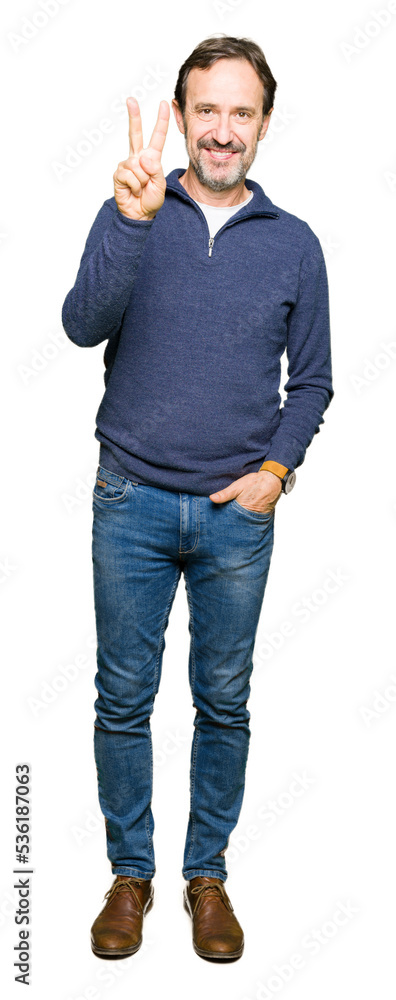 Fototapeta premium Middle age handsome man wearing a sweater showing and pointing up with fingers number two while smiling confident and happy.