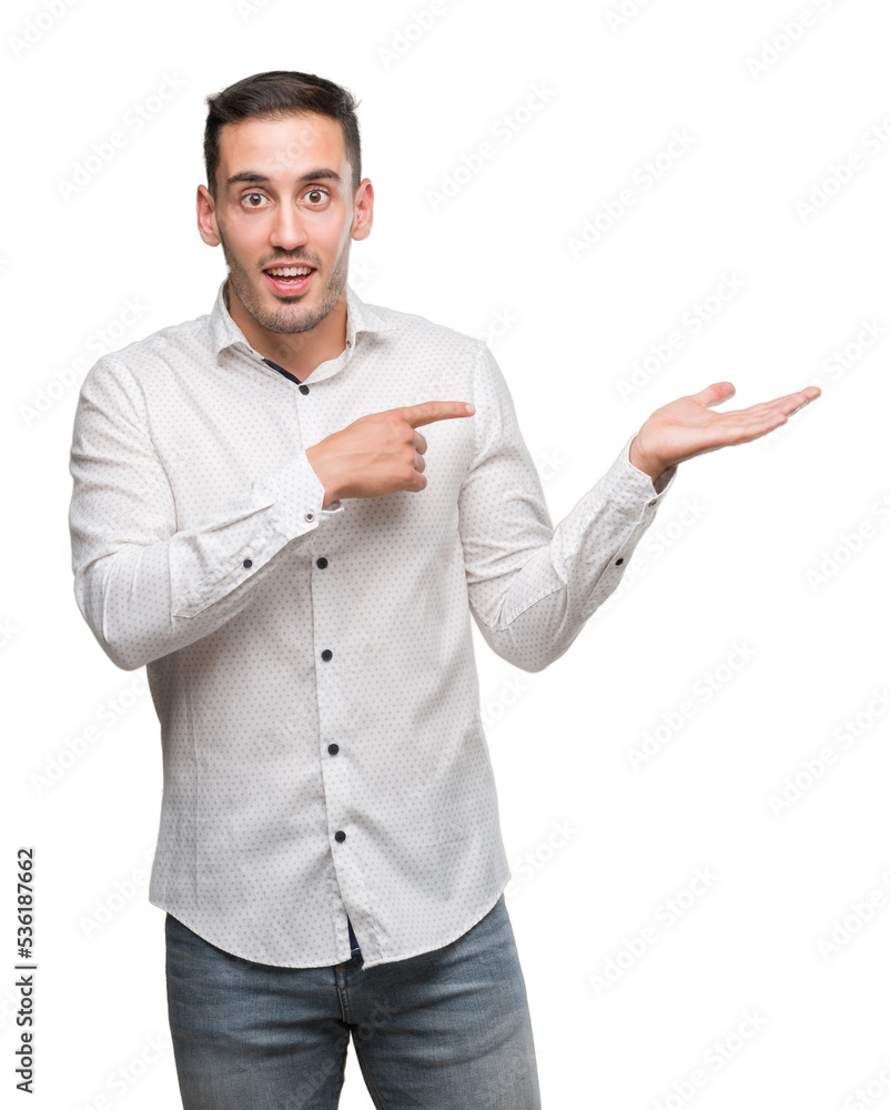 Handsome young business man very happy pointing with hand and finger Handsome young business man very happy pointing with hand and finger