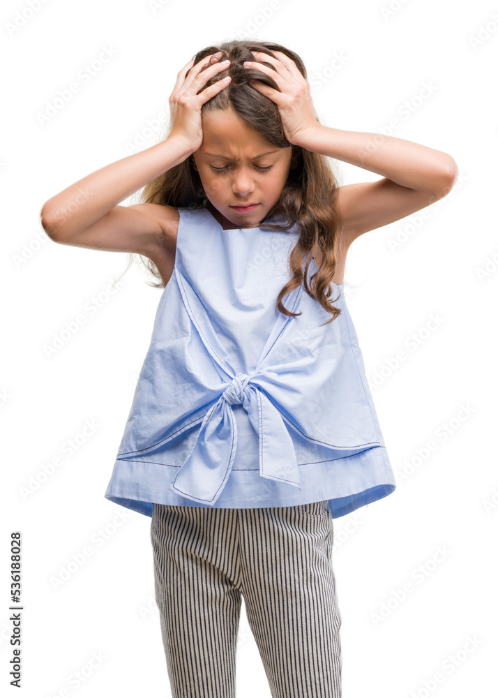 Brunette hispanic girl suffering from headache desperate and stressed because pain and migraine. Hands on head. Brunette hispanic girl suffering from headache desperate and stressed because pain and migraine. Hands on head.