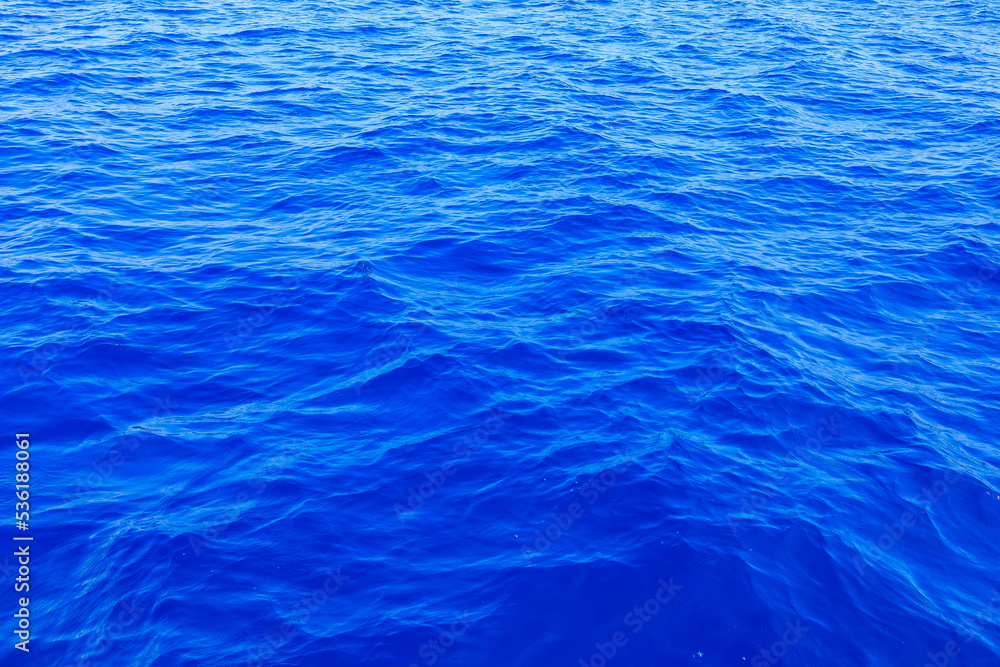Obraz premium Very nice sea water background or backdrop with selective focus. Small waves of natural water surface texture.