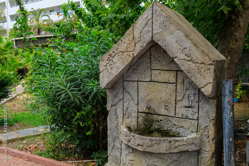 Traditional washbasin in the courtyard of the mosque. Background with copy space Traditional washbasin in the courtyard of the mosque. Background with copy space