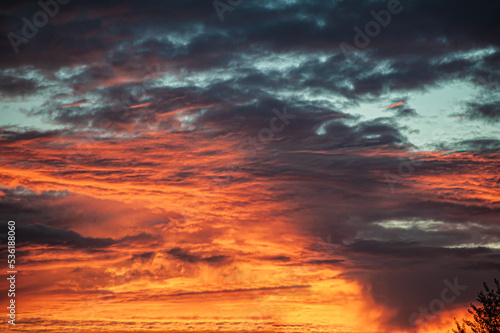 Sunset sunrise with clouds, light rays and other atmospheric effect