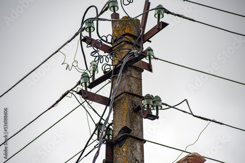 Electric lines overhaead, power line against bles sky photo