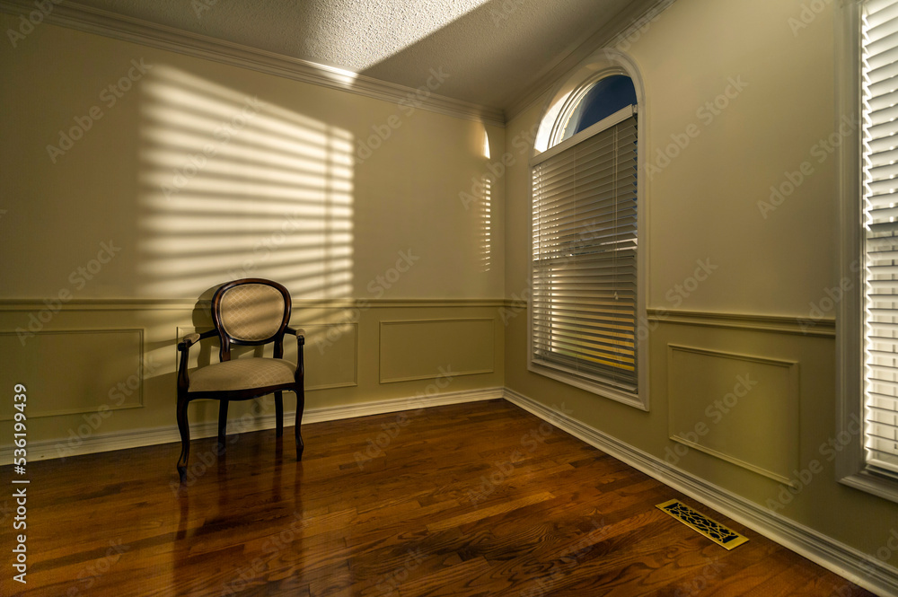 Fototapeta premium single chair in an empty room