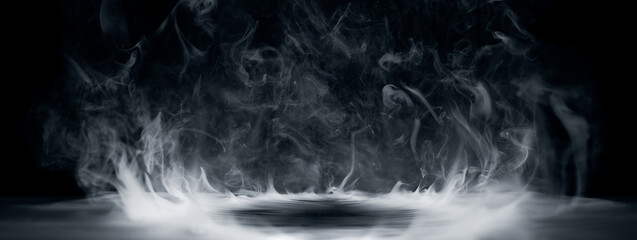 Real smoke exploding outwards with empty center. Dramatic smoke or fog effect for spooky Halloween background.