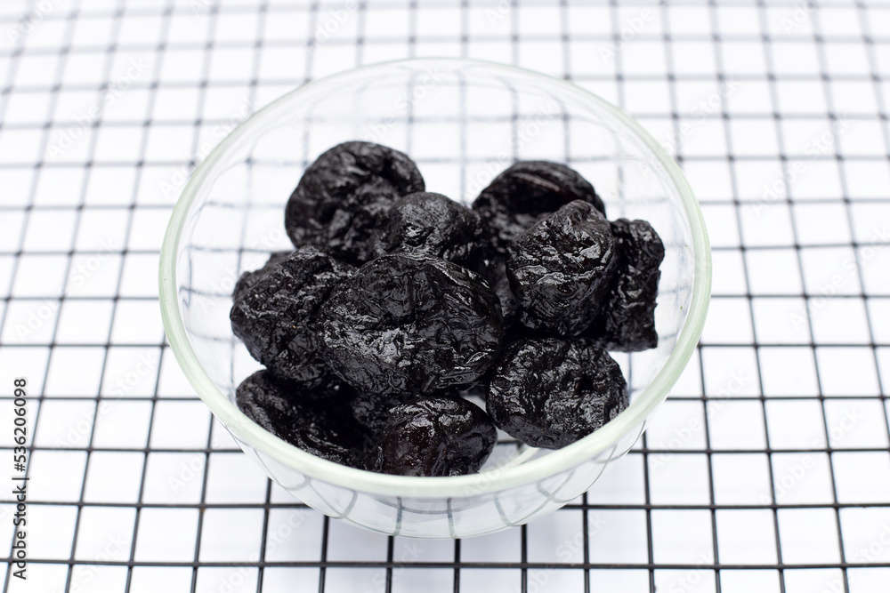 Dried prunes on white background Dried prunes on white background