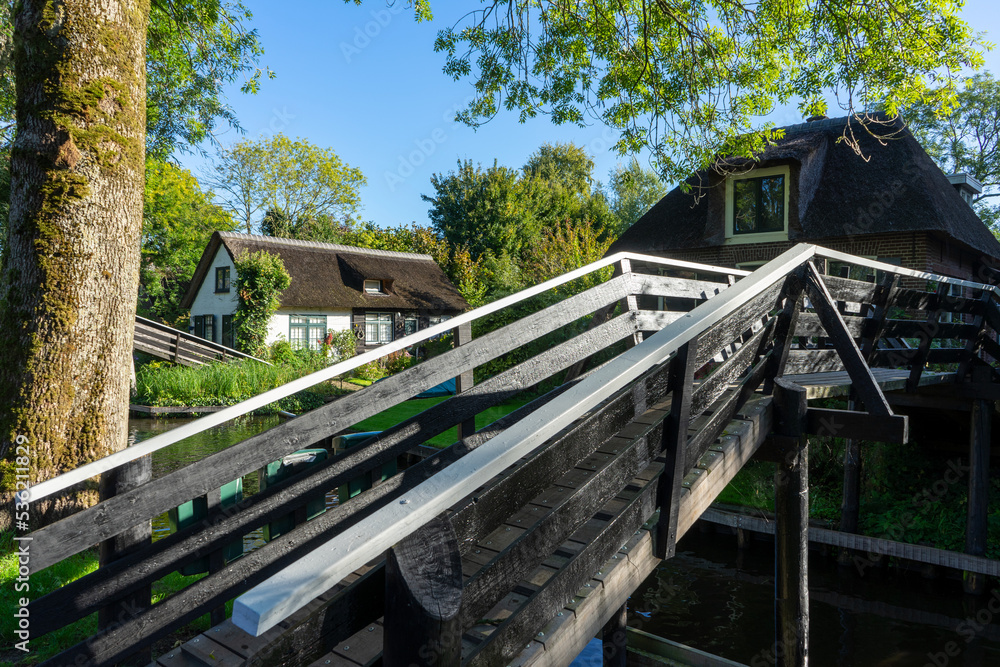 Giethoorn Netherlands Venice of the North old house in the village center along the canals with bridge