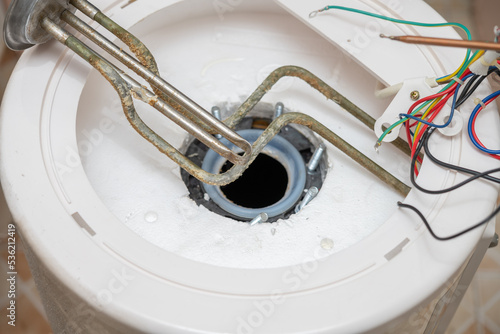 a water heater being taken apart and waiting for cleansing photo