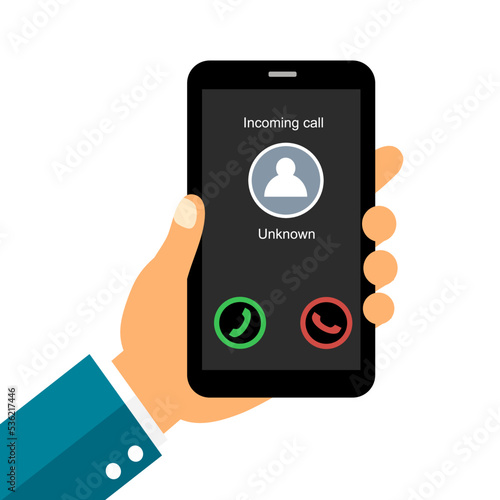 Hand holding mobile phone with unknown incoming call on smartphone screen. 