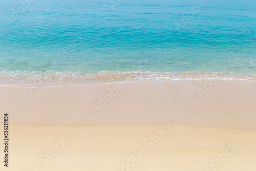 Fine sandy beach with clear blue sea water background, tropical island, outdoor day light