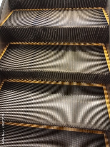 a photo of the escalator stairs in a mall