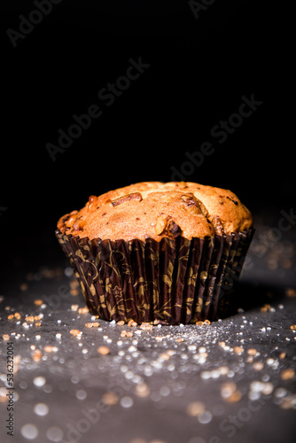 MUFFIN: A sweet and moist single-serving bread which is heavier than a cake or cupcake and is baked with cup-sized indentations 