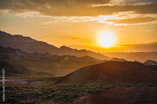 Warm sunset over the beautiful Dangxia Landforms, between the Gobi Desert and the Qilian Mountains. Gansu Province. China