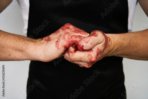 Man with bloody hands isolated on white