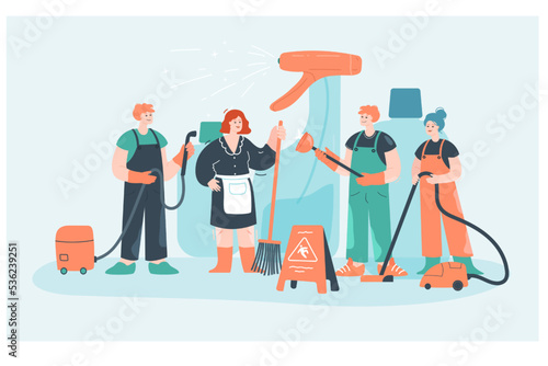 Team of tiny cartoon characters in uniform with vacuum cleaner. Cleaning staff with equipment flat vector illustration. Cleaning service, hygiene concept for banner, website design or landing web page