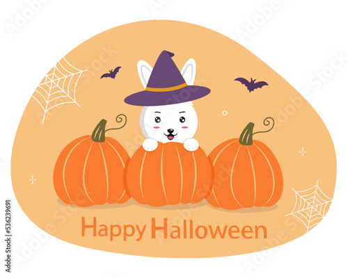 Happy Halloween. Funny rabbit in a witch's hat sits behind pumpkins. Festive Halloween rabbit character for design, print, greeting cards. Vector illustration