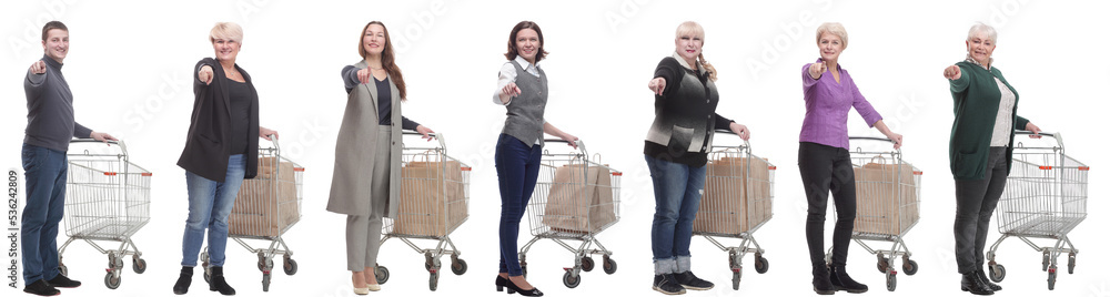 group of people with cart pointing finger at camera group of people with cart pointing finger at camera