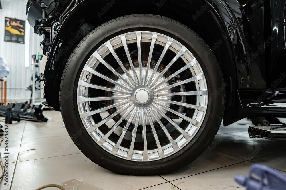 Close up view of a wheel of luxury car.