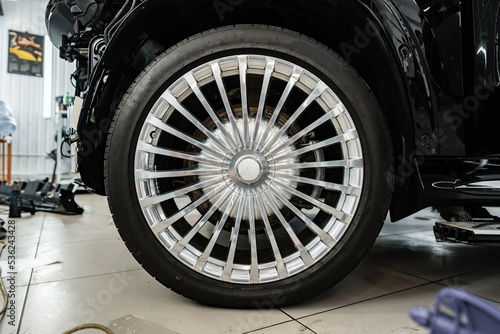 Close up view of a wheel of luxury car.