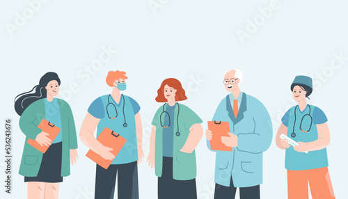 Doctor, nurse and medical staff in hospital team. Frontline clinic group of professional male and female workers standing together with smile flat vector illustration. Healthcare, medicine concept