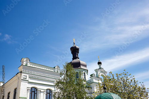 Kiev, Ukraine. Church building architecture, Pechersk Lavra monastery with cupol against blue sky background photo