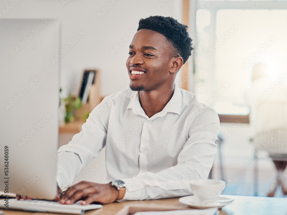 Computer, typing and black man working in the office, doing research and writing emails. Technology, work and businessman with smile on face in workspace for innovation, internet and startup company Computer, typing and black man working in the office, doing research and writing emails. Technology, work and businessman with smile on face in workspace for innovation, internet and startup company