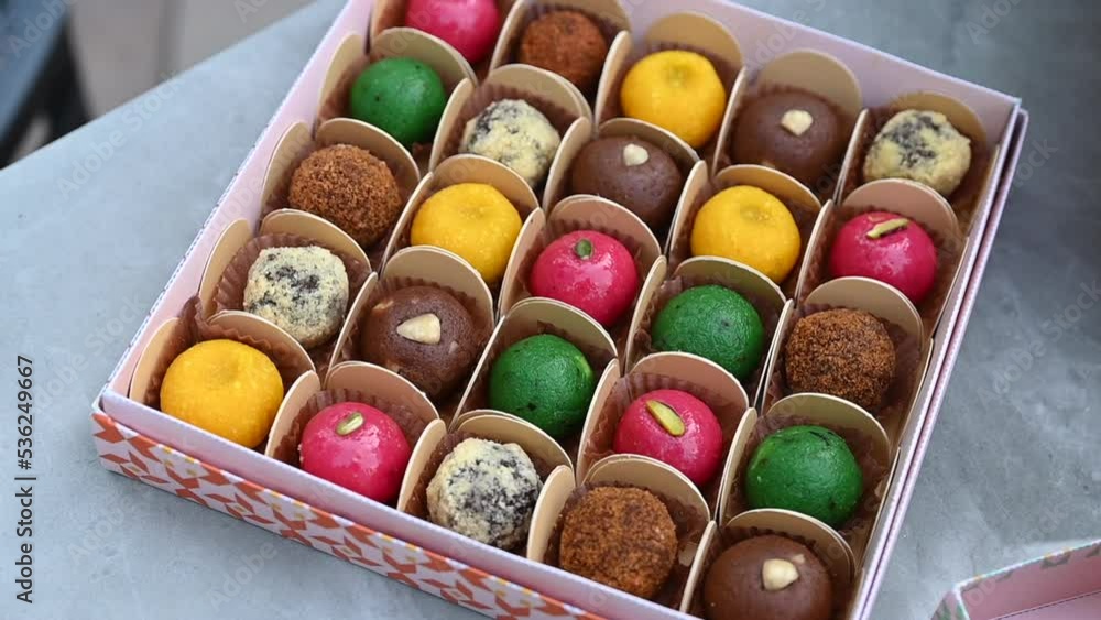Colourful Diwali sweets pack, Indian sweet festival dish called mithai, Asian sweets, Vegan sweets Colourful Diwali sweets pack, Indian sweet festival dish called mithai, Asian sweets, Vegan sweets