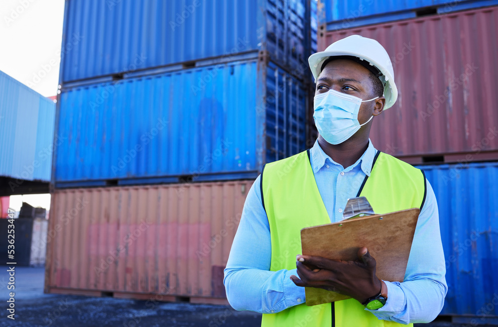 Logistics, shipping and businessman in covid with clipboard in cargo container yard. Construction worker with mask doing stock inspection for transportation, delivery and import and export industry